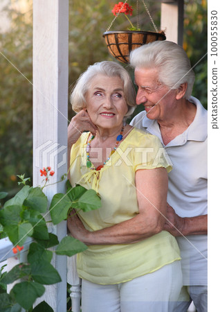 elderly couple walks in nature in summer elderly couple walks in nature in summer 100055830
