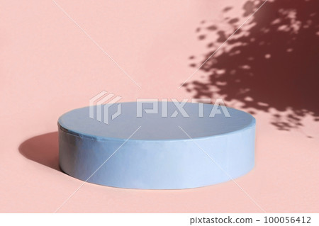 Podium for cosmetic product presentation. Abstract minimal form with geometrical form. Cylinder podium with Floral sunlight shadow. Scene to show products. Showcase, display case. Flat lay, top view Podium for cosmetic product presentation. Abstract minimal form with geometrical form. Cylinder podium with Floral sunlight shadow. Scene to show products. Showcase, display case. Flat lay, top view 100056412