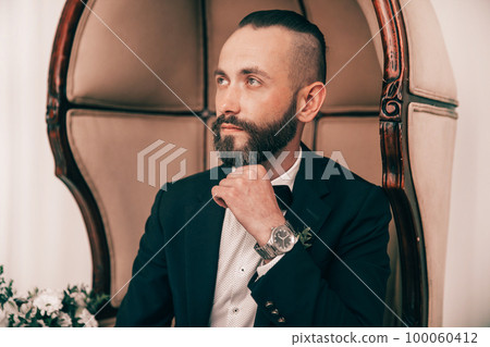 close up.portrait of an elegant man in a wedding suit close up.portrait of an elegant man in a wedding suit 100060412