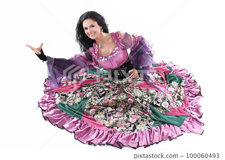 Young beautiful brunette dances a Gypsy dance.isolated on white 100060493