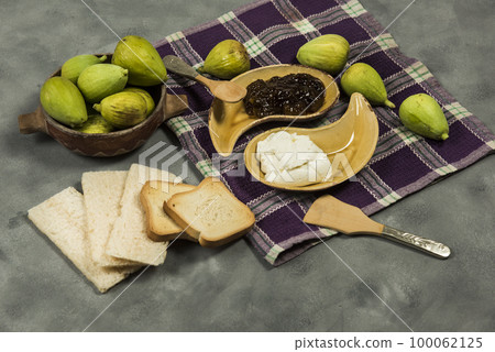 Fresh figs with ingredients on the table. Fresh figs with ingredients on the table. 100062125