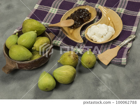Fresh figs with ingredients on the table. Fresh figs with ingredients on the table. 100062788