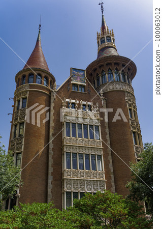 Barcelona, Spain Casa de les Punxes facade. External day view of Casa Terradas modernist building designed by Josep Puig I Cadafalch in the Barcelona Eixample area. Barcelona, Spain Casa de les Punxes facade. External day view of Casa Terradas modernist building designed by Josep Puig I Cadafalch in the Barcelona Eixample area. 100063012