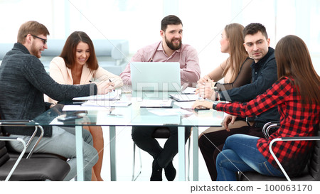 Business people showing team work while working in board room in office interior. Business people showing team work while working in board room in office interior. 100063170