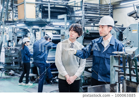 A male student visiting a factory A male student visiting a factory 100063885