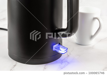 Electric kettle switch glows blue while turned on. Electric kettle switch glows blue while turned on. 100065746