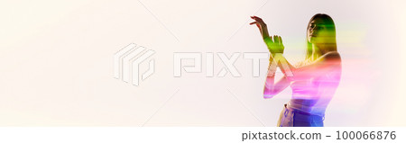 Surreal portrait of young adorable woman posing over white background with mixed neon colored light on her body. Concept of contemporary art, fashion, futurism Surreal portrait of young adorable woman posing over white background with mixed neon colored light on her body. Concept of contemporary art, fashion, futurism 100066876