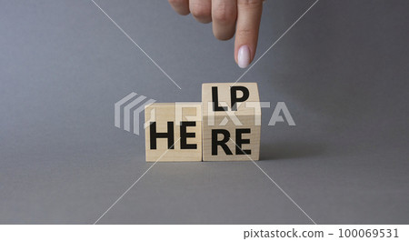 Help is here symbol. Businessman hand points at turned wooden cube with words Here to Help. Beautiful grey background. Business and Help is here concept. Copy space Help is here symbol. Businessman hand points at turned wooden cube with words Here to Help. Beautiful grey background. Business and Help is here concept. Copy space 100069531