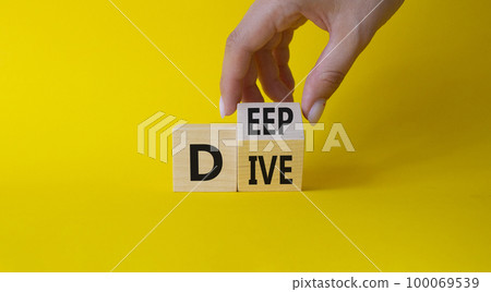 Deep Dive symbol. Businessman hand. Concept words deep dive on wooden cubes. Beautiful yellow background. Business and Deep Dive concept. Copy space 100069539