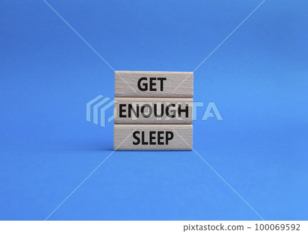 Get enough sleep symbol. Wooden blocks with words Get enough sleep. Beautiful blue background. Healthy lifestyle, medical and Get enough sleep concept. Copy space. 100069592