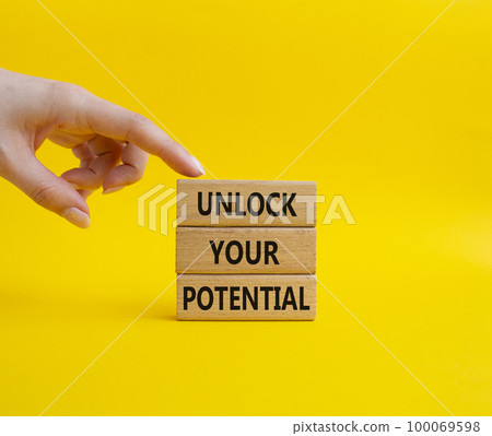 Unlock your Potential symbol. Wooden blocks with words Unlock your Potential. Beautiful yellow background. Businessman hand. Business and Unlock your Potential concept. Copy space. Unlock your Potential symbol. Wooden blocks with words Unlock your Potential. Beautiful yellow background. Businessman hand. Business and Unlock your Potential concept. Copy space. 100069598