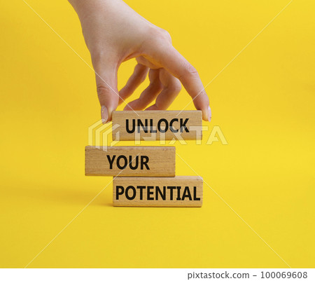 Unlock your Potential symbol. Wooden blocks with words Unlock your Potential. Beautiful yellow background. Businessman hand. Business and Unlock your Potential concept. Copy space. Unlock your Potential symbol. Wooden blocks with words Unlock your Potential. Beautiful yellow background. Businessman hand. Business and Unlock your Potential concept. Copy space. 100069608