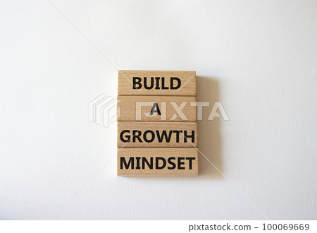 Build a growth mindset symbol. Concept words Build a growth mindset on wooden blocks. Beautiful white background. Business and Build a growth mindset world concept. Copy space. Build a growth mindset symbol. Concept words Build a growth mindset on wooden blocks. Beautiful white background. Business and Build a growth mindset world concept. Copy space. 100069669