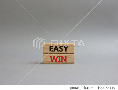 Easy win symbol. Wooden blocks with words Easy win. Beautiful grey background. Business and Easy win concept. Copy space. Easy win symbol. Wooden blocks with words Easy win. Beautiful grey background. Business and Easy win concept. Copy space. 100072349