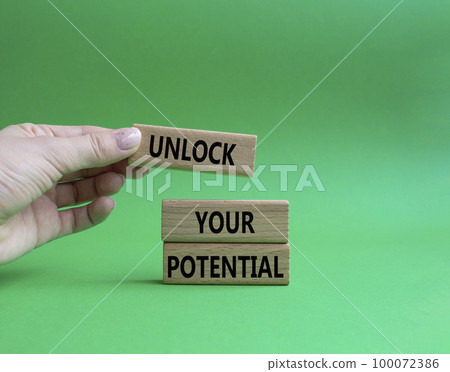 Unlock your Potential symbol. Wooden blocks with words Unlock your Potential. Beautiful green background. Businessman hand. Business and Unlock your Potential concept. Copy space. Unlock your Potential symbol. Wooden blocks with words Unlock your Potential. Beautiful green background. Businessman hand. Business and Unlock your Potential concept. Copy space. 100072386