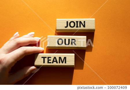 Join our team symbol. Wooden blocks with words Join our team. Beautiful orange background. Businessman hand. Business and Join our team concept. Copy space. 100072409