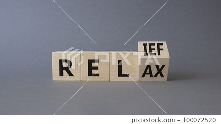 Relief and relax symbol. Turned wooden cubes with words Relief and Relax. Beautiful grey background. Business and Relief and relax concept. Copy space Relief and relax symbol. Turned wooden cubes with words Relief and Relax. Beautiful grey background. Business and Relief and relax concept. Copy space 100072520