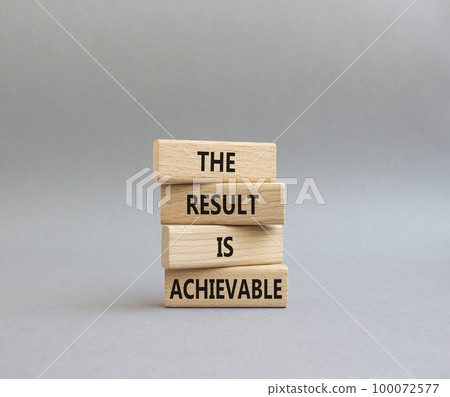 The result is achievable symbol. Concept words The result is achievable on wooden blocks. Beautiful grey background. Business and The result is achievable concept. Copy space. 100072577