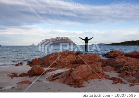 Rocky and Sandy Beach in Porto Istana, Sardinia, Italy. Tavolara Island in Background. 100073599