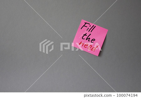 Fill the need symbol. Concept word Fill the need on steaky pink note. Beautiful grey background. Business and Fill the need concept. Copy space 100074194