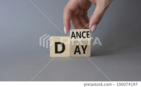 International Dance Day symbol. Businessman hand turns wooden cubes with words Dance day. Beautiful grey background. International Dance Day concept. Copy space. 100074197