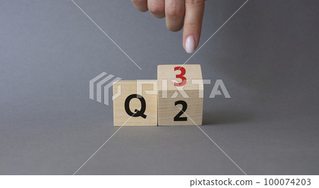 From 2nd Quarter to 3rd symbol. Businessman hand points at turned wooden cube with words 2nd Quarter and 3rd Quarter. Beautiful grey background. Business and Quarter concept. Copy space From 2nd Quarter to 3rd symbol. Businessman hand points at turned wooden cube with words 2nd Quarter and 3rd Quarter. Beautiful grey background. Business and Quarter concept. Copy space 100074203