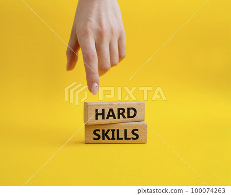 Hard skills symbol. Wooden blocks with words Hard skills. Beautiful yellow background. Businessman hand. Business and Hard skills concept. Copy space. Hard skills symbol. Wooden blocks with words Hard skills. Beautiful yellow background. Businessman hand. Business and Hard skills concept. Copy space. 100074263