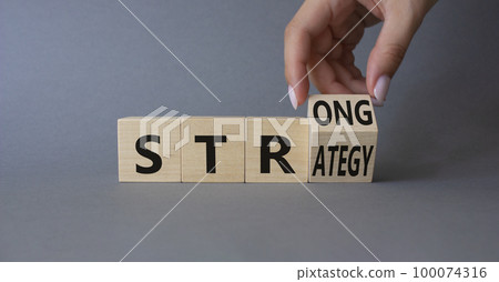 Strong Stress symbol. Businessman Hand turns cubes with words Strong Stress. Beautiful grey background. Business and Strong Stress concept. Copy space Strong Stress symbol. Businessman Hand turns cubes with words Strong Stress. Beautiful grey background. Business and Strong Stress concept. Copy space 100074316