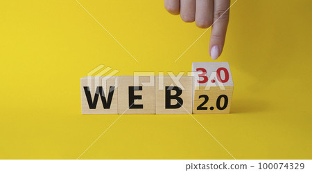 Web 3.0 vs Web 2.0 symbol. Businessman hand points at turned wooden cubes with words web 2.0 to web 3.0. Beautiful yellow background. Business concept. Copy space Web 3.0 vs Web 2.0 symbol. Businessman hand points at turned wooden cubes with words web 2.0 to web 3.0. Beautiful yellow background. Business concept. Copy space 100074329