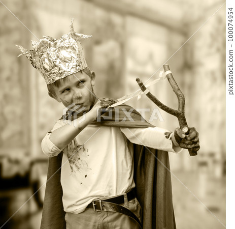 Little boy with a rocker dressed as a prince Little boy with a rocker dressed as a prince 100074954