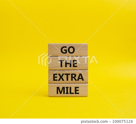 Go the extra mile symbol. Wooden blocks with words Go the extra mile. Beautiful yellow background. Business and Go the extra mile concept. Copy space. Go the extra mile symbol. Wooden blocks with words Go the extra mile. Beautiful yellow background. Business and Go the extra mile concept. Copy space. 100075128