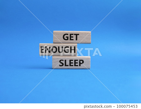 Get enough sleep symbol. Wooden blocks with words Get enough sleep. Beautiful blue background. Healthy lifestyle, medical and Get enough sleep concept. Copy space. 100075453