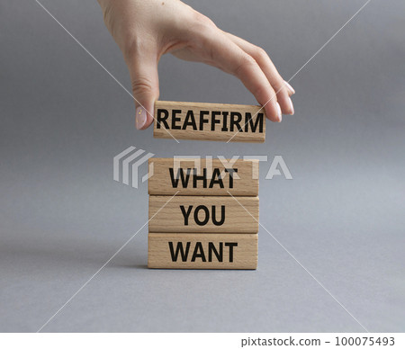 Goals symbol. Wooden blocks with words Reaffirm what you want. Beautiful grey background. Businessman hand. Business and Reaffirm what you want concept. Copy space. Goals symbol. Wooden blocks with words Reaffirm what you want. Beautiful grey background. Businessman hand. Business and Reaffirm what you want concept. Copy space. 100075493