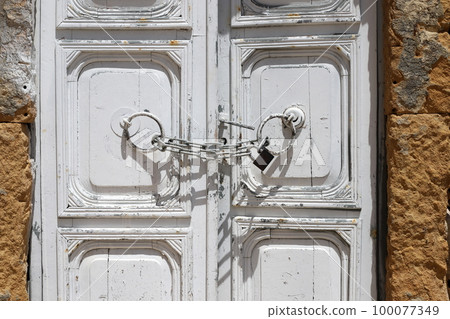 The old castle hangs on the closed gate. The old castle hangs on the closed gate. 100077349