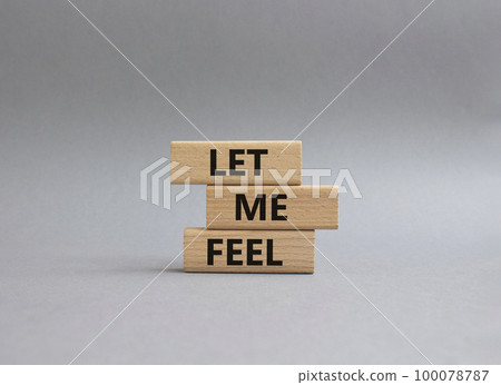 Feel symbol. Wooden blocks with words 'Let me feel'. Beautiful grey background. Psychology and let me feel concept. Copy space. 100078787