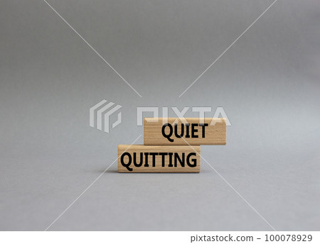 Quiet quitting symbol. Concept word Quiet quitting on wooden blocks. Beautiful grey background. Business and Quiet quitting concept. Copy space. Quiet quitting symbol. Concept word Quiet quitting on wooden blocks. Beautiful grey background. Business and Quiet quitting concept. Copy space. 100078929