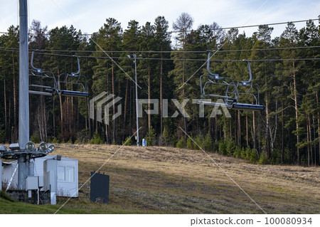 Ski cable car among the trees in autumn. 100080934