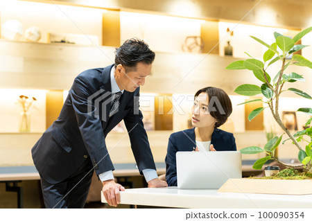 Businessman career woman office Businessman career woman office 100090354