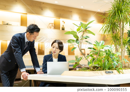 Businessman career woman office Businessman career woman office 100090355