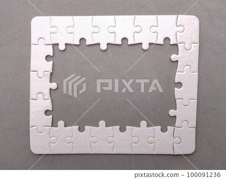 Top view white puzzle on a gray background with text space. 100091236