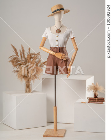 Vintage mannequin with hands on a light studio background 100092924