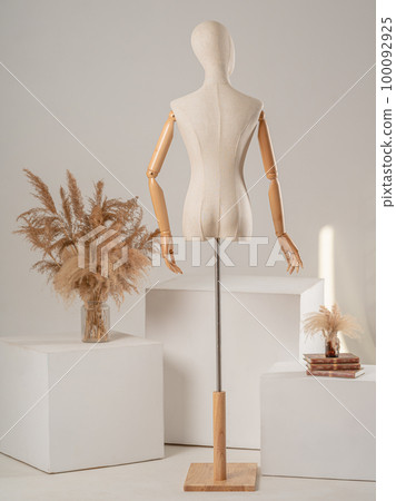 Vintage mannequin with hands on a light studio background Vintage mannequin with hands on a light studio background 100092925