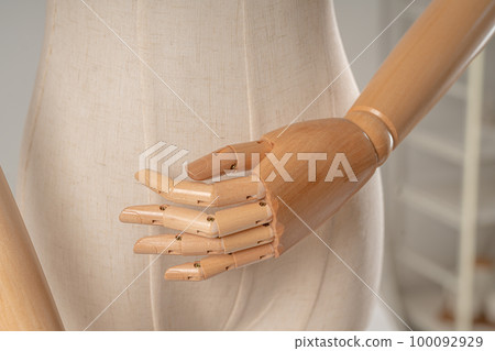 Vintage mannequin with hands on a light studio background Vintage mannequin with hands on a light studio background 100092929