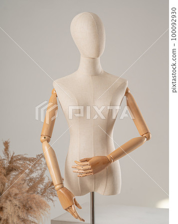 Vintage mannequin with hands on a light studio background Vintage mannequin with hands on a light studio background 100092930