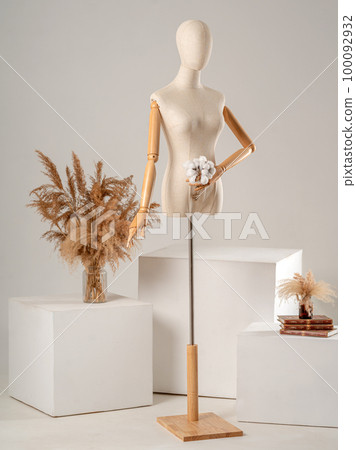 Vintage mannequin with hands on a light studio background Vintage mannequin with hands on a light studio background 100092932