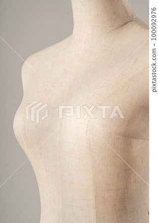 Vintage mannequin without hands on a light studio background Vintage mannequin without hands on a light studio background 100092976