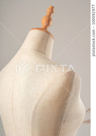 Vintage mannequin without hands on a light studio background Vintage mannequin without hands on a light studio background 100092977