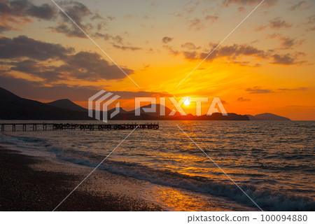 Sunrise on Koktebel beach. Crimea 100094880