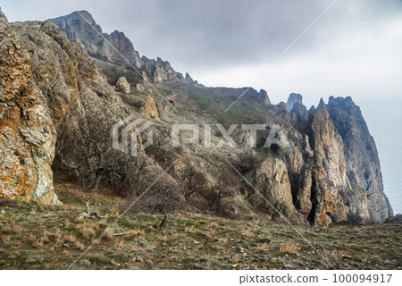 Rocks in Dead city. Khoba-Tele Ridge of Karadag Reserve in spring. Crimea Rocks in Dead city. Khoba-Tele Ridge of Karadag Reserve in spring. Crimea 100094917