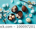 Easter composition with chocolate eggs and cherry branches 100097201
